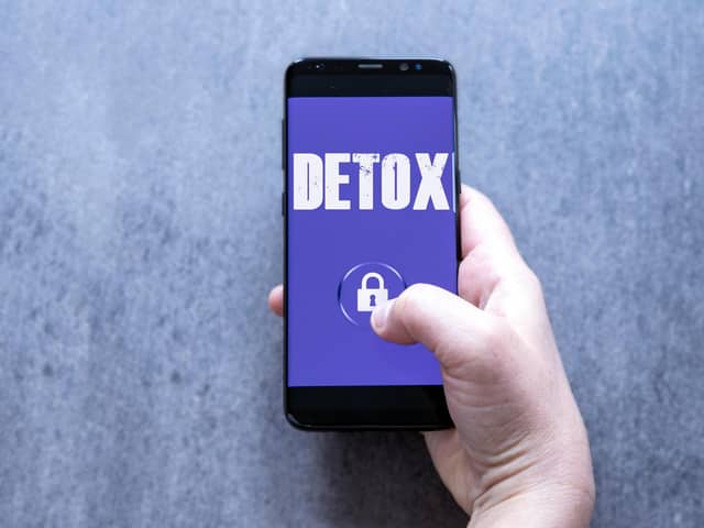 A photo of a phone with the word detox and a lock symbol on the screen. PIC: Alamy/PA