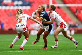 Leeds' Lucy Murray is tackled by Eboni Partington and Luci McColm. Picture by Will Palmer/SWpix.com.