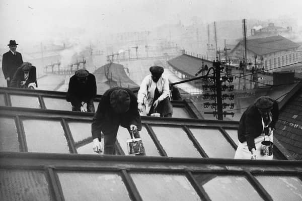 The annual cleaning and painting of the York station roof in December 1934.
