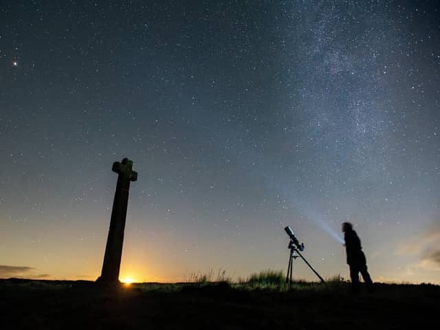 Dark Skies campaigner Richard Darn surveys the night sky as the moon sets at Ralphs Cross, Westerdale on the North York Moors.Picture Bruce Rollinson