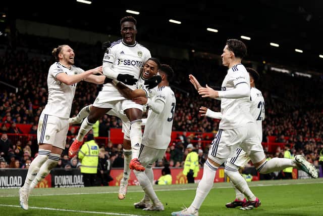 MANCHESTER, ENGLAND - FEBRUARY 08: Wilfried Gnonto of Leeds United celebrates with Crysencio Summerville after Raphael Varane of Manchester United concedes an own goal, the second goal for Leeds United, during the Premier League match between Manchester United and Leeds United at Old Trafford on February 08, 2023 in Manchester, England. (Photo by Naomi Baker/Getty Images)