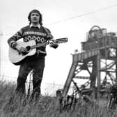 Charlie Livingstone pictured playing his guitar outside Sharlston pit during the miners strike 1984