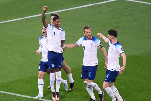 DOHA, QATAR - NOVEMBER 21: Marcus Rashford celebrates with Phil Foden, Jack Grealish, Harry Kane and Declan Rice  after scoring their team's fifth goal during the FIFA World Cup Qatar 2022 Group B match between England and IR Iran at Khalifa International Stadium on November 21, 2022 in Doha, Qatar. (Photo by Laurence Griffiths/Getty Images)