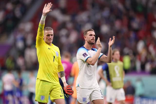 AL KHOR, QATAR - NOVEMBER 25: Jordan Pickford (L) and Jordan Henderson of England applaud fans after the 0-0 draw during the FIFA World Cup Qatar 2022 Group B match between England and USA at Al Bayt Stadium on November 25, 2022 in Al Khor, Qatar. (Photo by Ryan Pierse/Getty Images)