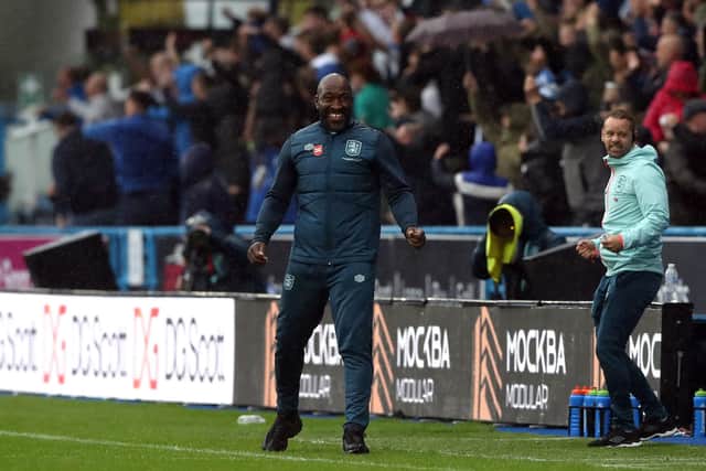 Huddersfield Town manager Darren Moore celebrates their side's first goal of the game, scored by Delano Burgzorg (not pictured) during the Sky Bet Championship match at John Smith's Stadium, Huddersfield. Picture date: Saturday September 30, 2023. PA Photo. See PA story SOCCER Huddersfield. Photo credit should read: Tim Markland/PA Wire

RESTRICTIONS: EDITORIAL USE ONLY No use with unauthorised audio, video, data, fixture lists, club/league logos or "live" services. Online in-match use limited to 120 images, no video emulation. No use in betting, games or single club/league/player publications.
