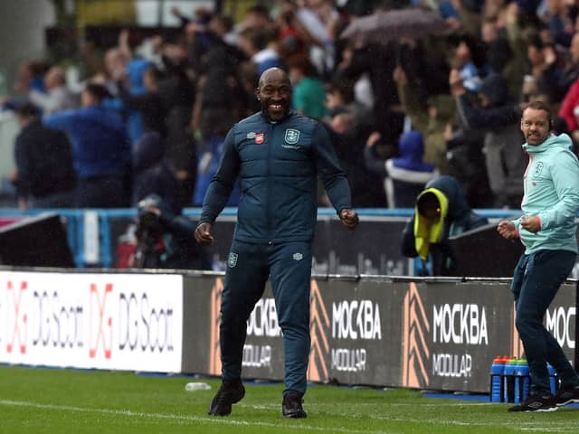 Huddersfield Town manager Darren Moore celebrates their side's first goal of the game, scored by Delano Burgzorg (not pictured) during the Sky Bet Championship match at John Smith's Stadium, Huddersfield. Picture date: Saturday September 30, 2023. PA Photo. See PA story SOCCER Huddersfield. Photo credit should read: Tim Markland/PA WireRESTRICTIONS: EDITORIAL USE ONLY No use with unauthorised audio, video, data, fixture lists, club/league logos or "live" services. Online in-match use limited to 120 images, no video emulation. No use in betting, games or single club/league/player publications.