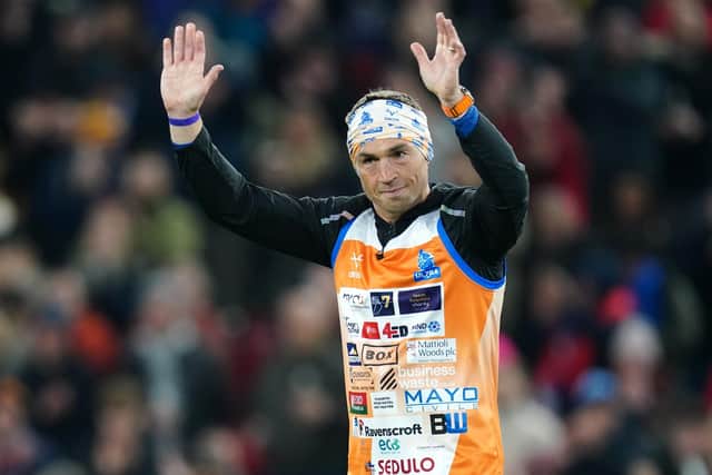 Kevin Sinfield salutes fans at half-time during the Rugby League World Cup final at Old Trafford, Manchester. The former Leeds captain has completed seven ultra-marathons in as many days in aid of research into Motor Neurone Disease. Picture: David Davies/PA Wire.
