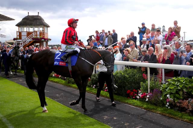 LAST RIDE: Jockey Paul Hanagan is led around the parade ring on Wootton'Sun before competing in the Sky Bet Handicap, his last race before retirement, at York Racecourse. Picture: Simon Marper/PA