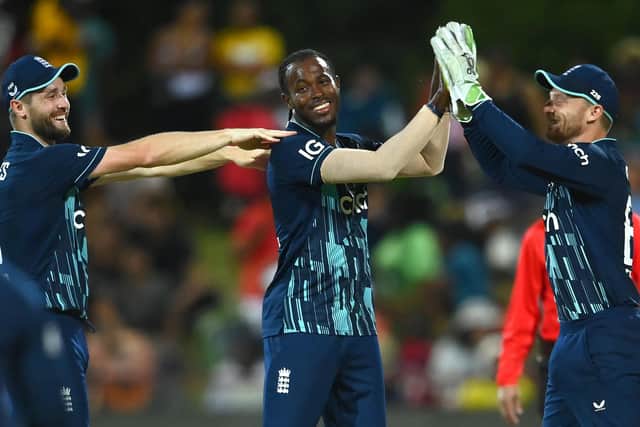 All smiles: Jofra Archer, centre, is congratulated by Chris Woakes, left, and Jos Buttler after bowling Wayne Parnell to achieve his maiden five-wicket haul in one-day international cricket. Photo by Alex Davidson/Getty Images.