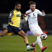 Oxford United's Djavan Anderson and Barnsley's Nicky Cadden, right, who scored in a game in hand that the Tykes won (Picture: Adam Davy/PA Wire)