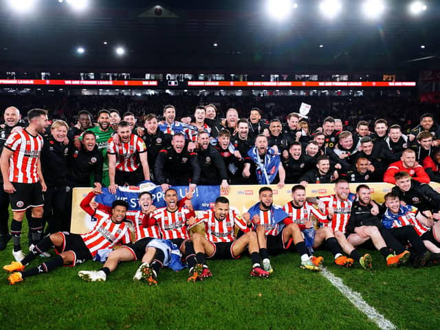 We are going up: Sheffield United players and staff members celebrate being promoted to the Premier League (Picture: David Davies/PA Wire)
