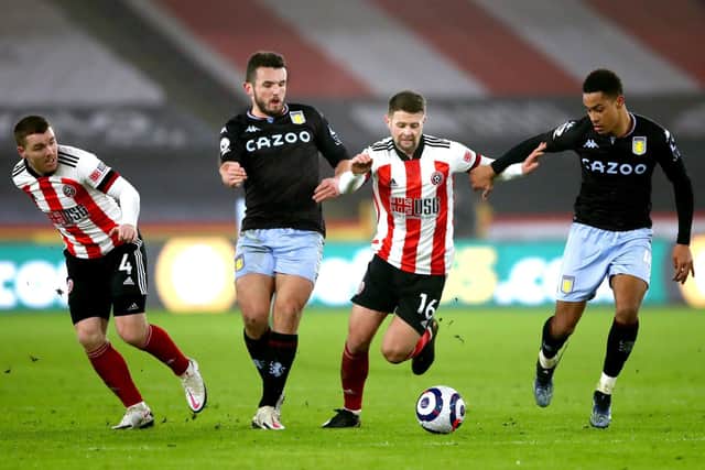 STALWARTS: Sheffield United still rely on much of the core of their last Premier League side, such as John Fleck (left) and Oliver Norwood (second right)