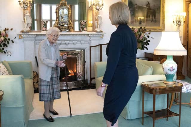 Queen Elizabeth II welcomes Liz Truss during an audience at Balmoral, Scotland, last year. PIC: Jane Barlow/PA Wire