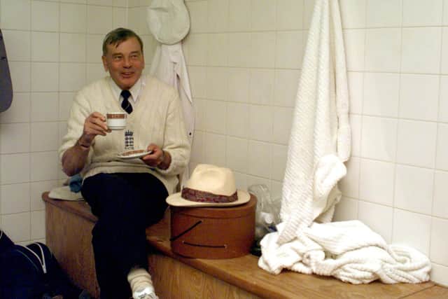 Tea time: Umpire Dickie Bird takes time out to drink a cup of tea as play is delayed due to rain.