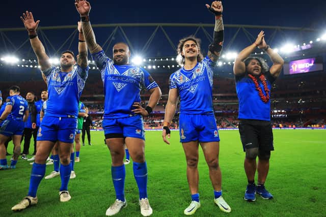 Samoa players soak in their semi-final win over England. (Photo by Matthew Lewis/Getty Images for RLWC)