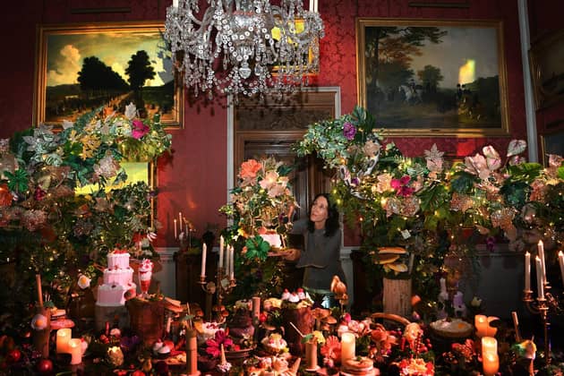 Juliane Schaub, puts the finishing touches to a display at the Christmas in Neverland at Castle Howard, near York. Picture Jonathan Gawthorpe