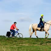 The Department for Environment, Food and Rural Affairs and Natural England have committed to consulting with Cycling UK and The British Horse Society after legal threats over access to a new National Trail.