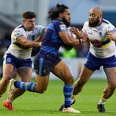 Warrington Wolves' Sam Kasiano and Joe Philbin tackle Jorge Taufua of Wakefield Trinity. Picture by Paul Currie/SWpix.com
