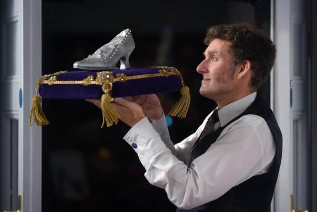 "A Magical Couple of Hours": A Celebration of Pantomime in Halifax, curated by The Friends of The Victoria Theatre in collaboration with Calderdale Museums Service and The Victoria Theatre. The display offers a nostalgic journey through a beloved theatrical tradition, and forms part of the Victoria Theatre's 125th Anniversary celebrations. Pictured curator Eli Dawson with a slipper on cushion from Cinderella. Picture Jonathan Gawthorpe