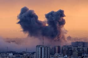 A plume of smoke rises after a strike on the Iranian capital Tehran, on March 3, 2026. Iran stepped up its attacks on economic targets and US missions across the Middle East on Tuesday as the US president warned it was "too late" for the Islamic republic to seek talks to escape the war. (Photo by ATTA KENARE / AFP via Getty Images)