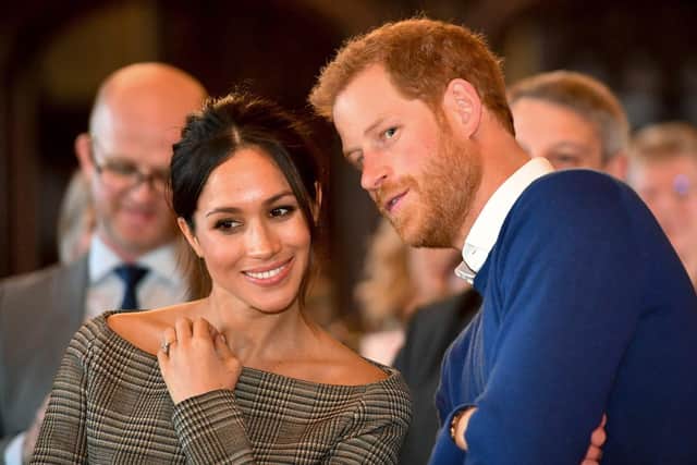 Prince Harry whispers to Meghan Markle Picture: Ben Birchall - WPA Pool / Getty Images