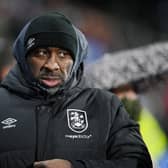 Darren Moore's Huddersfield Town are hovering precariously above the relegation zone. Image: Ben Roberts Photo/Getty Images