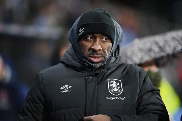 Darren Moore's Huddersfield Town are hovering precariously above the relegation zone. Image: Ben Roberts Photo/Getty Images