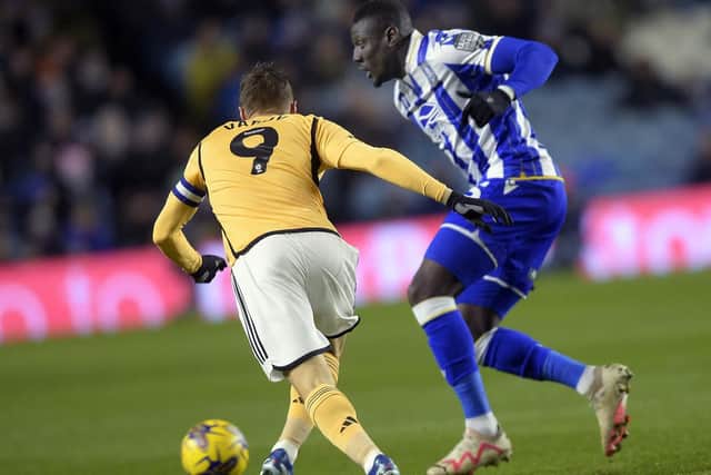 Owls' Bambo Diaby holds off Leicester;s Jamie Vardy (Picture; Steve Ellis)