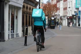 Library image of a Deliveroo rider, as the takeaway delivery group said efforts to cut costs boosted its profitability, despite revealing a drop in order numbers amid a slowdown in demand after years of pandemic-boosted trading.