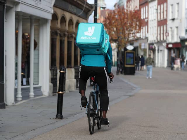 Library image of a Deliveroo rider, as the takeaway delivery group said efforts to cut costs boosted its profitability, despite revealing a drop in order numbers amid a slowdown in demand after years of pandemic-boosted trading.