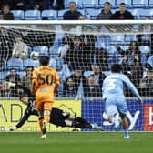 Hull City's Fabio Carvalho (hidden, left) scores their side's second goal of the game from the penalty spot during the Sky Bet Championship match at Coventry. Photo: Nigel French/PA Wire.