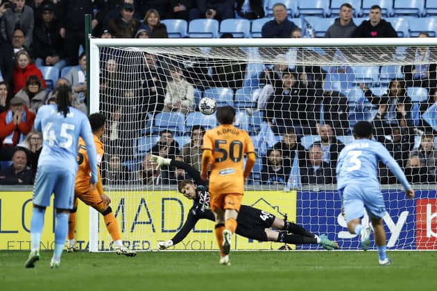 Hull City's Fabio Carvalho (hidden, left) scores their side's second goal of the game from the penalty spot during the Sky Bet Championship match at Coventry. Photo: Nigel French/PA Wire.