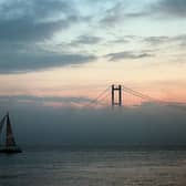 A yacht makes its way down the River Humber as a late autumn fog bank shrouds the lower half of the Humber Bridge. Picture: John Jones