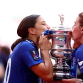 Sam Kerr and Millie Bright of Chelsea kiss the Vitality Women's FA Cup trophy after the team's victory during last year's final. Who will succeed them in 2023/24? (Picture: Clive Rose/Getty Images)