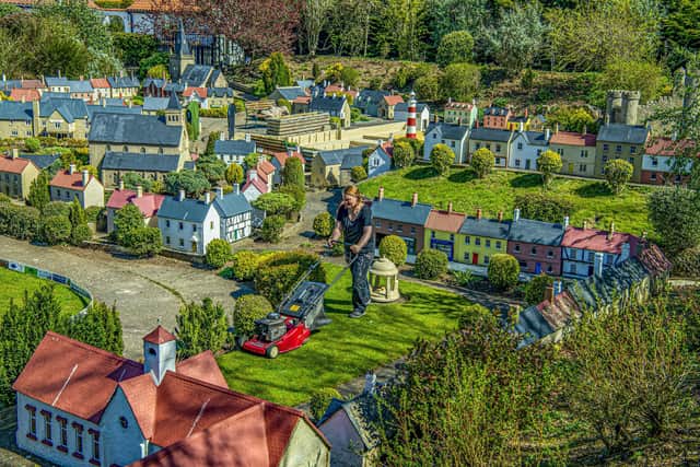 Gardener Sophie Revitt cuts the grass as final preparations were made at Bondville Model Village at Sewerby, Bridlington for its reopening for the start of the season last year. Picture Tony Johnson