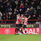 Sheffield United's Tommy Doyle (centre) celebrates with teammates after scoring their side's third goal of the game during the Sky Bet Championship match at Bramall Lane, Sheffield. Picture date: Monday December 26, 2022. Picture: Isaac Parkin/PA Wire.