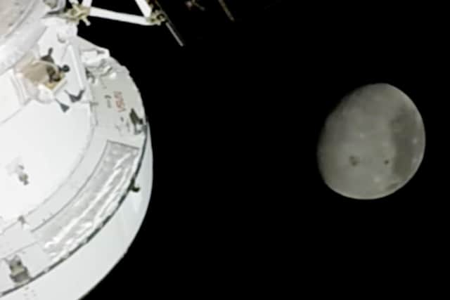 In this image from video provided by NASA, the Moon is seen from a camera outside the Orion Spacecraft after the Artemis II astronauts surpassed the farthest distance ever traveled by humans from Earth, Monday, April 6, 2026. (NASA via AP)