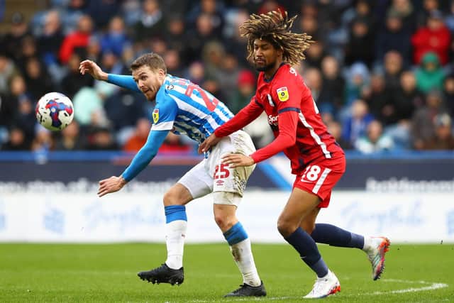 TROUBLES: Huddersfield Town's Danny Ward (left) and Birmingham City's Dion Sanderson battle for the ball at the John Smith's Stadium on Saturday. Picture: Tim Markland/PA.