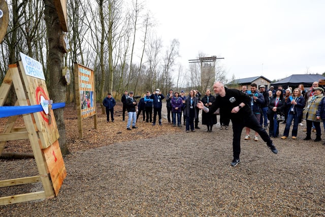 European Axe Throwing Champion, Carl Howe, officially opening Adventure Wood by butting the ribbon with an axe throw.