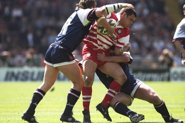 Tony Mestrov of Wigan Warriors is tackled during the Silk Cut Challenge Cup final against Sheffield Eagles at Wembley Stadium in London. (Picture: Alex Livesey/Allsport)