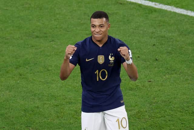 DOHA, QATAR - DECEMBER 04: Kylian Mbappe #10 of France celebrates after scoring the team's third goal in the second half against Poland during the FIFA World Cup Qatar 2022 Round of 16 match between France and Poland at Al Thumama Stadium on December 04, 2022 in Doha, Qatar. (Photo by Elsa/Getty Images)