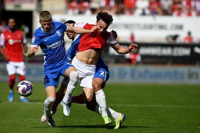 Oliie Rathbone, of Rotherham United, is tackled for the ball by Jordan James, and Maxime Colin, of Birmingham City. Picture: James Hardisty.
