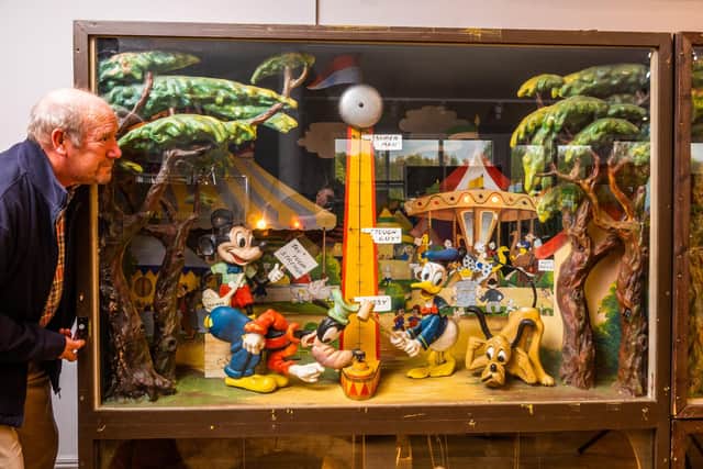 Andy Spicer looking at one of four very rare Disney scene's this being a Disney Fairground Scene Display, by Pytram Ltd of New Malton, Surrey, c.1936/38, a laminated cellulose fibre musical automaton display, playing on a polyphone disc, 186 x 88 x 190cm.
Copy of the original letter of instructions.
Provenance; originally made for the entrance hall of Butlins, either Clacton on Sea or Skegness.
Provenance; Watermouth Castle, Ilfracombe, North Devon. Picture By Yorkshire Post Photographer,  James Hardisty. Date: 15th November 2023.