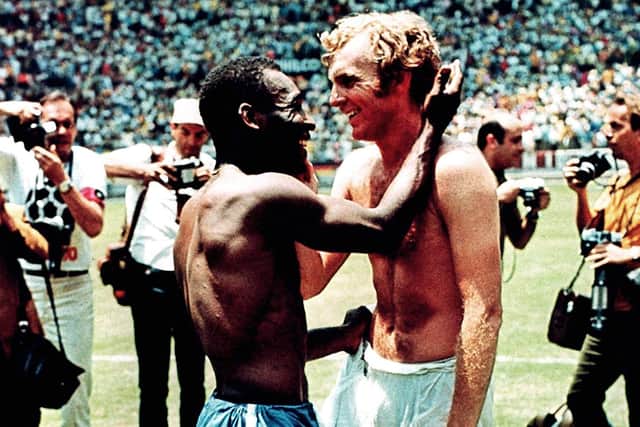 SPORTSMANSHIP: Pele exchanges shirts with Bobby Moore after an epic encounter between Brazil and England at the 1970 World Cup
