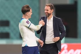 England’s Jack Grealish (left) celebrates with manager Gareth Southgate during the World Cup.
