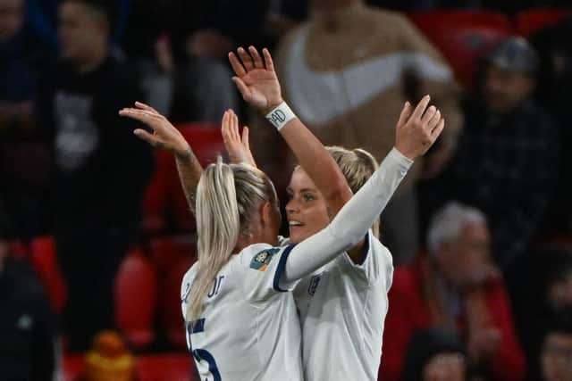 Rachel Daly celebrates her goal against China in the group stage with Alex Greenwood (Picture: BRENTON EDWARDS/AFP via Getty Images)