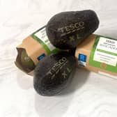 A UK supermarket will use lasers to draw size information onto some of its avocados instead of using stickers, in a trial designed to help the environment. (Photo by Tesco/PA Wire)