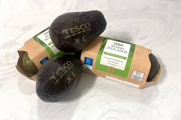 A UK supermarket will use lasers to draw size information onto some of its avocados instead of using stickers, in a trial designed to help the environment. (Photo by Tesco/PA Wire)