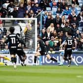 Huddersfield Town's Rhys Healey (obscured) scores their side's leveller during the Sky Bet Championship match versus Birmingham City at the John Smith's Stadium. Picture: Jess Hornby/PA Wire.