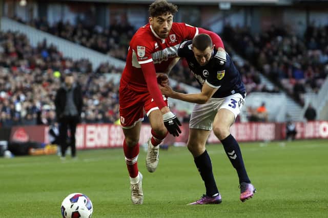 Middlesbrough's Matt Crooks (left) and Millwall's Murray Wallace battle for the ball during the Sky Bet Championship match at the Riverside Stadium, Middlesbrough. Picture: Will Matthews/PA